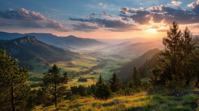 Mountainous countryside at sunset with rolling grassy hills, scattered trees, and soft golden evening light fading into distant hazy ridges and valleys creating a serene rural natural landscape