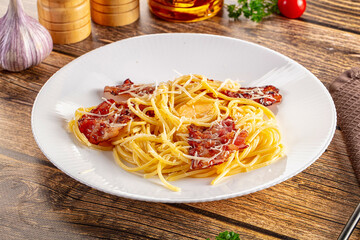 Italian classic spaghetti carbonara with bacon and egg