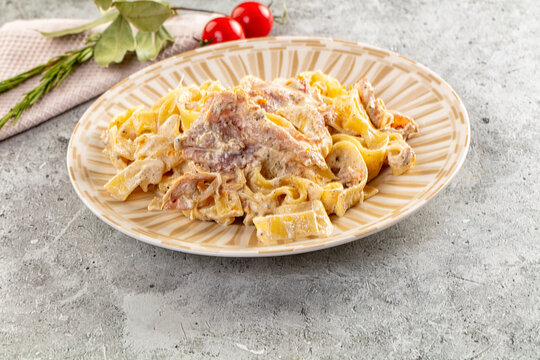 Italian pasta fettuccine with prosciutto - Powered by Adobe