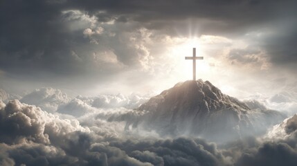 A serene cross stands atop a rocky mountain peak illuminated by bright rays of light. Soft clouds envelop the scene creating a peaceful and divine atmosphere.