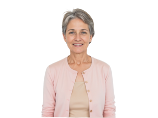 Smiling older woman with short grey hair wearing a pink cardigan in a simple setting