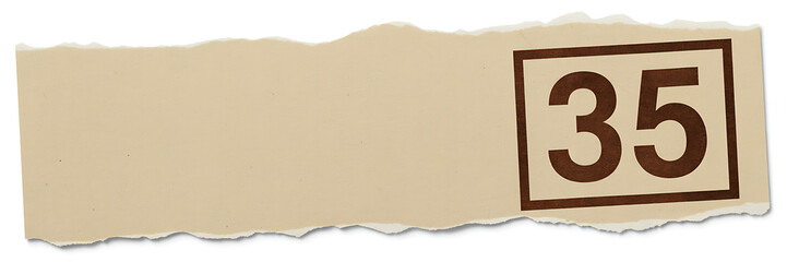 A torn piece of beige paper with the number 35 stamped on it