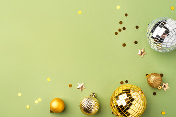 Festive Christmas gold ornaments on a green background.