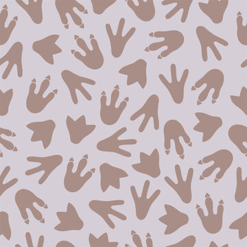 Dinosaur footprints on grey background seamless pattern. Template for print, fabric, wallpaper, wrapping paper. Vector illustration