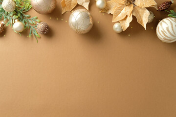 Elegant top border with shiny Christmas ornaments and golden poinsettias on a blank tan background.