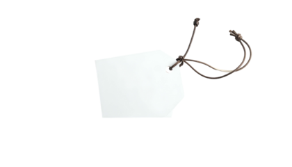 A white, empty tag hangs by brown string against a deep black background