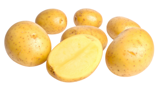 Close-up of fresh, raw, golden potatoes; one halved, arranged on a dark backdrop