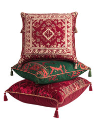 Stacked, ornate cushions in red, green, gold tones