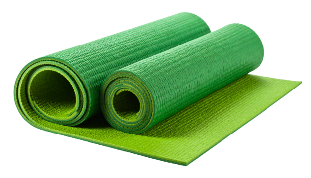 Close-up of two rolled-up green mats and a flat one, on a black background, for fitness
