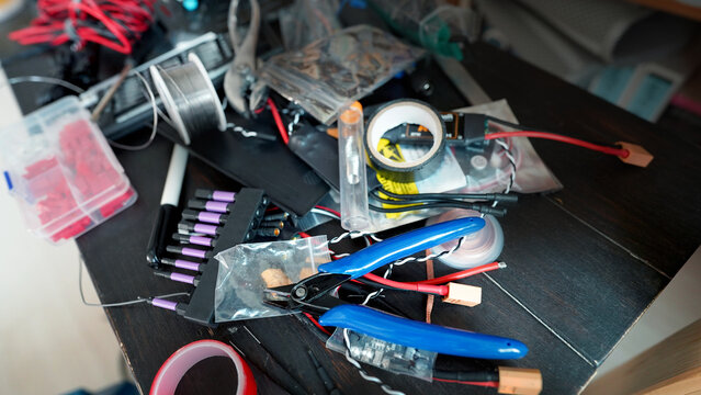 Electrician’s workspace with tools and wires for maintenance and repair