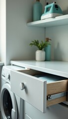Hidden ironing board, chrome hardware, smooth drawer front, appliance, neat, board