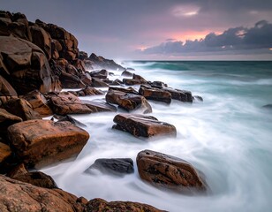 Dramatic seascape showcasing rugged rocks and foamy wave action
