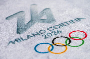 Fototapeta premium Logo of Winter Game 2026 in Milano and Cortina, Italy. White background, macro and detail