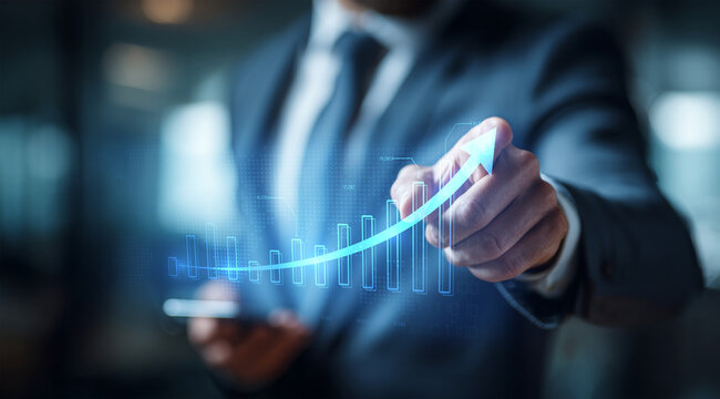 Businessman touching a glowing line graph overlaying a bar chart, symbolizing financial growth, excellent business performance, and rising market success.