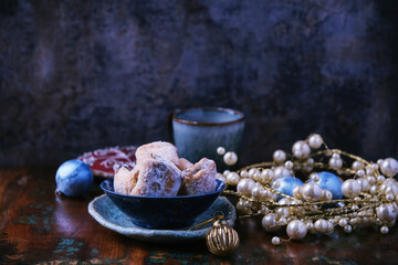 Traditional christmas cookies in a bowl on a rustic wooden background. Soft focus.	