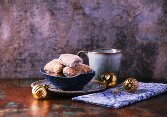 Traditional christmas cookies in a bowl on a rustic wooden background. Soft focus.	