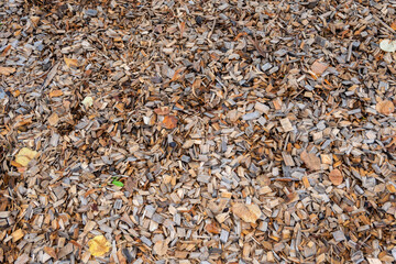 Natural wood chips material for playground. Nature background.