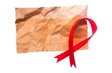 aids awareness ribbon with blank old crumpled paper isolated on white