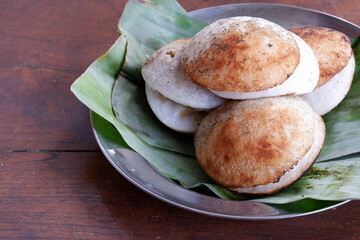 Surabi is a traditional snack typical of Bandung, made from a mixture of rice flour and coconut milk, which is cooked on a small stove using a clay mold