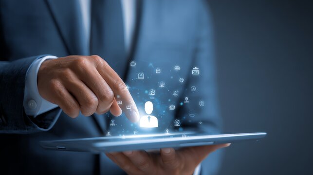 A business professional interacts with digital icons on a tablet, showcasing the fusion of technology and connectivity in the modern workplace with a focus on innovation.