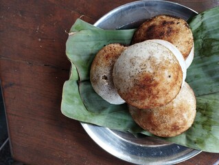 Surabi is a traditional snack typical of Bandung, made from a mixture of rice flour and coconut milk, which is cooked on a small stove using a clay mold