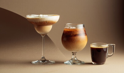 Black coffee and iced coffee cocktails on a beige background.