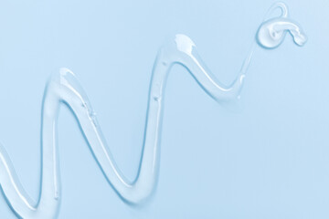 cosmetic texture gel essence on a blue background close-up