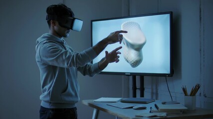 Young man wearing virtual reality headset. Immersive digital experience and interactive simulation technology concept. Futuristic innovation.