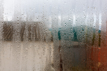 View from the window through the fogged glass.