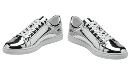 Gleaming pair of silver sneakers, white soles and laces, isolated on black