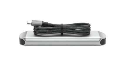 A metallic device, flat and rectangular, with a coiled, braided cable on top, all on black