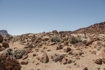 A stunning view of a rocky volcanic landscape on Tenerife, highlighting the islands unique terrain and clear skies