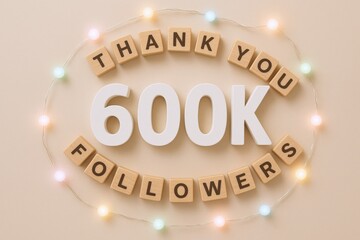 600K Followers Appreciation Display with Decorative Lights, Beige Backdrop, Thank You Message, Social Media Milestone