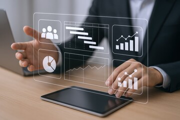 Businessman analyzing project timeline, charts, and workflow on a digital interface over a tablet device