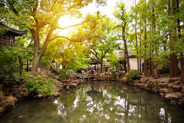 Traditional chinese architecture among trees of Yu garden in Shanghai, China