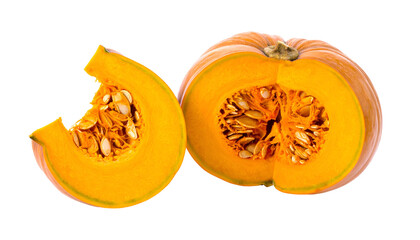 Close-up of a partially cut pumpkin and a slice revealing seeds and bright orange flesh