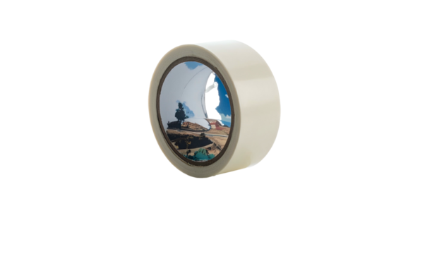 A roll of tan masking tape, partially unrolled, with an image visible inside its core