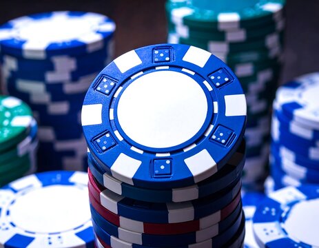 Stacks of colorful casino chips for gambling games.
