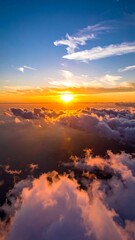 Fototapeta premium Aerial view of a stunning sunset over a fluffy cloudscape