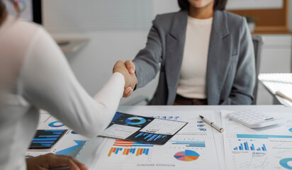 Business partnership handshake on financial agreement in office