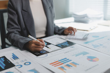 Businesswoman analyzing financial data reports calculating profits