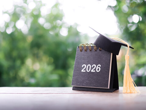 Study goals, 2026 Desk calendar with graduation hat. The concept for Resolution, Goal, Action, Planning, and manage time to success graduate.