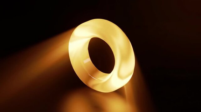 Illuminated golden ring floating against a dark background with soft glow
