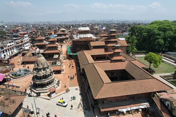 Fototapeta premium Patan Durbar Square in Nepal is a historic hub of palaces, temples, and courtyards, showcasing exquisite Newar architecture, cultural heritage, and centuries of artistry.