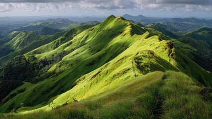 A panoramic view of lush green mountain ridges and rolling hills beneath a cloudy sky. Concept Panoramic mountain ridges, Lush green rolling hills, Cloudy sky, Misty valleys, Expansive landscape