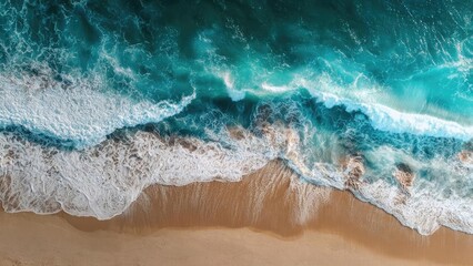 Aerial view of turquoise ocean waves breaking onto a sandy beach with white foam. Concept Aerial photography, Turquoise ocean, Sandy beach, Breaking waves, White foam