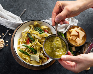 Vegetarian vegan green pasta, Fettuccine pasta with pesto sauce. Healthy food.