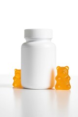Supplement Bottle with Orange Gummy Bears on White Background vitamin