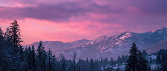 Snow covered mountains and pine trees under a vibrant pink and purple sunset sky image