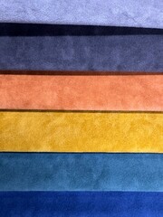 Fabric swatches in different colors, upholstery material for furniture. Samples of fabrics